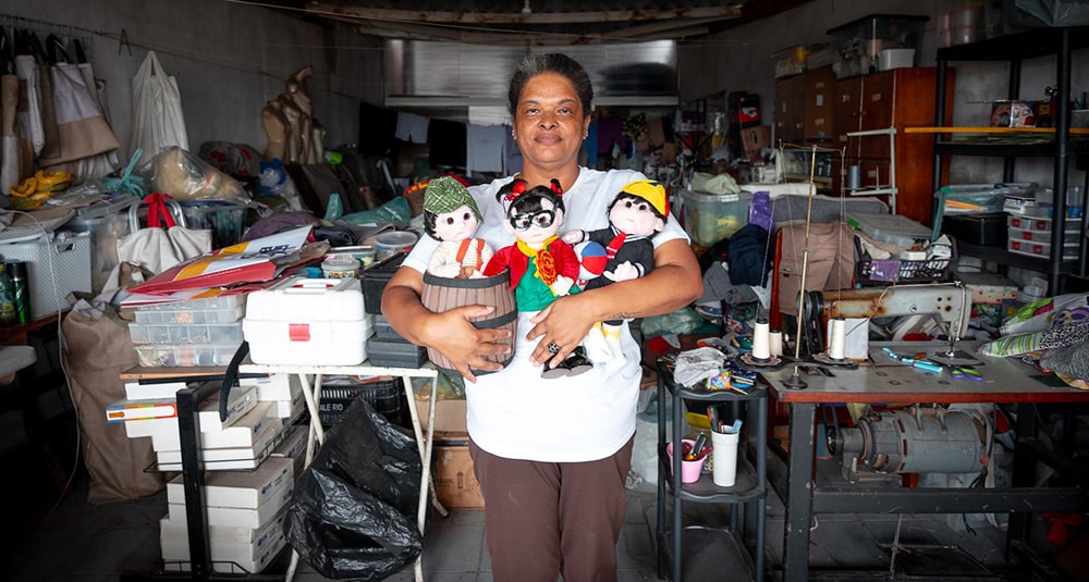 Edna-with-handmade-Chaves,-Chiquinha,-and-Kiko-dolls
